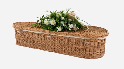 Child's willow coffin with a curved-end shape, buff in colour and featuring buff woven willow handles