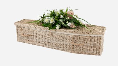 Child's willow coffin with a traditional shape, weatherbeaten gold in colour and featuring weatherbeaten gold woven willow handles